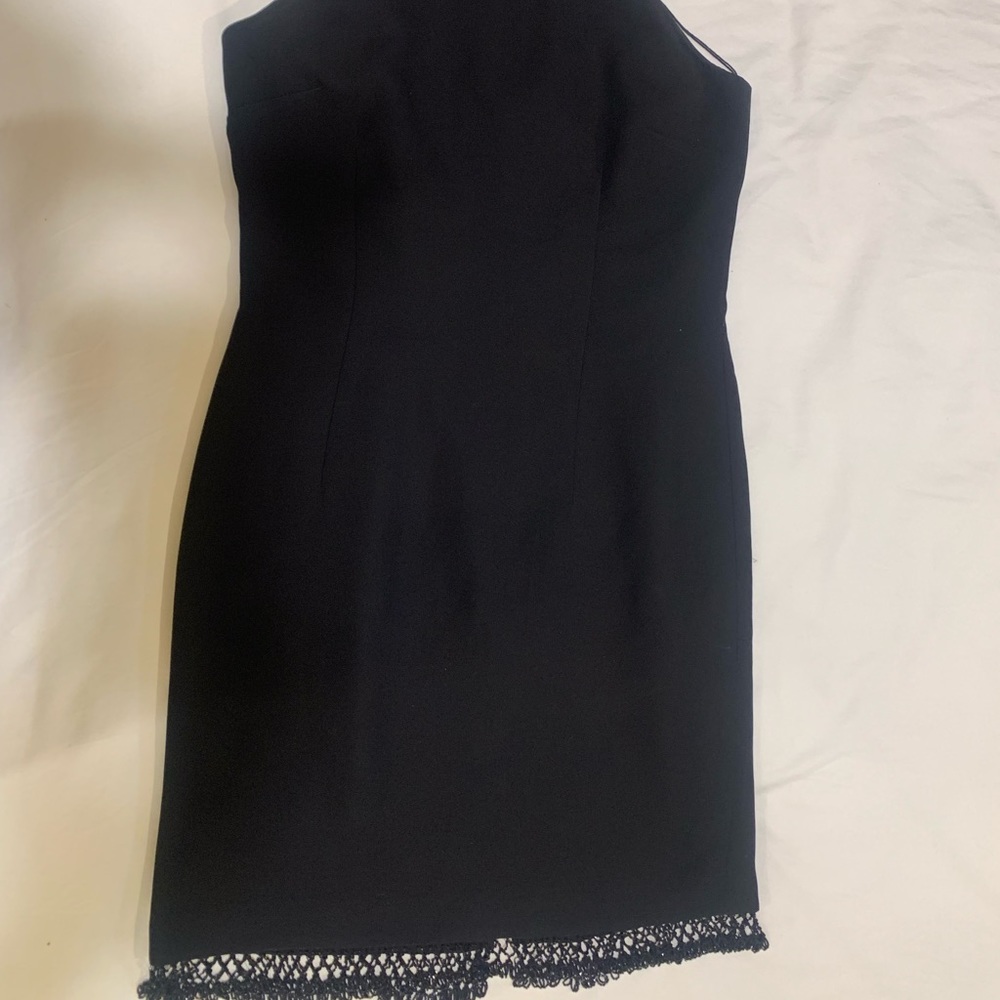 Black crepe cocktail dress.